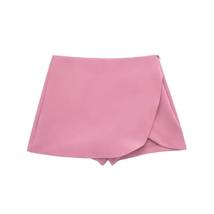 Dame asymmetrisk skort med høj talje og åndbarhed, der kombinerer shorts' praktiske anvendelighed og nederdelens elegance.