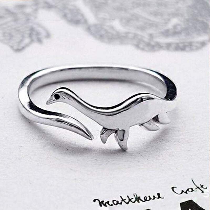 Dame sølv dinosaurussring med hvidguldbelægning, tilgængelig med Tyranno eller Tricera-motiver, stilfuld og legesyg.