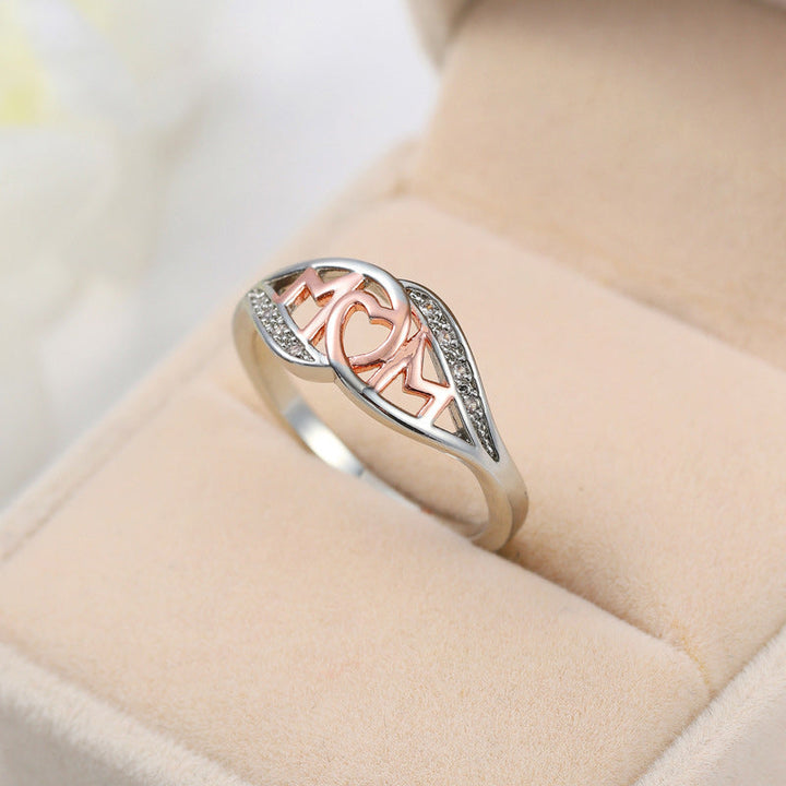 Dame elegant mor-ring, rosaguld med zirkon-detaljer, elegant skinnende finish, ideel gave til mor.