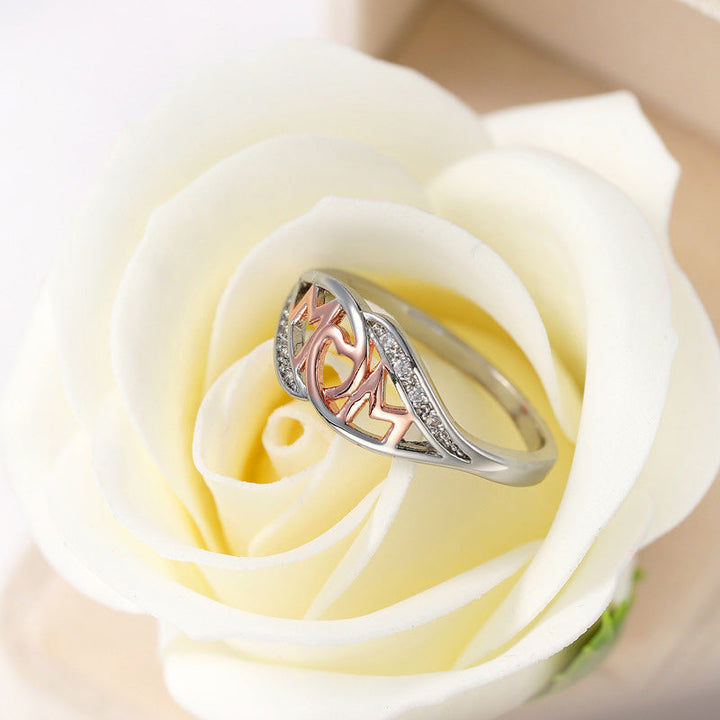 Dame elegant mor-ring, rosaguld med zirkon-detaljer, elegant skinnende finish, ideel gave til mor.