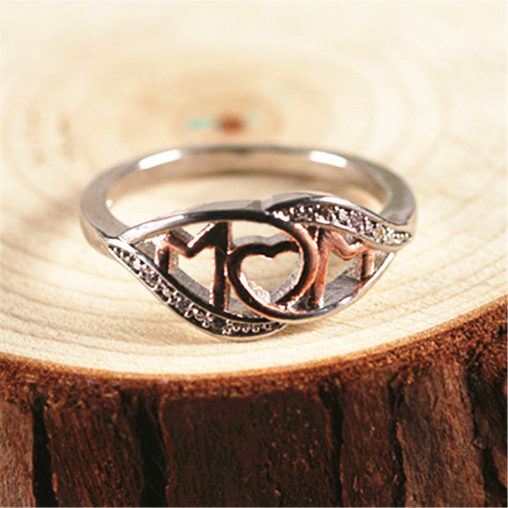 Dame elegant mor-ring, rosaguld med zirkon-detaljer, elegant skinnende finish, ideel gave til mor.