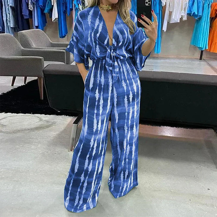 Dame jumpsuit med dyb V-hals, vide ben og blonde detaljer, sommerkjole