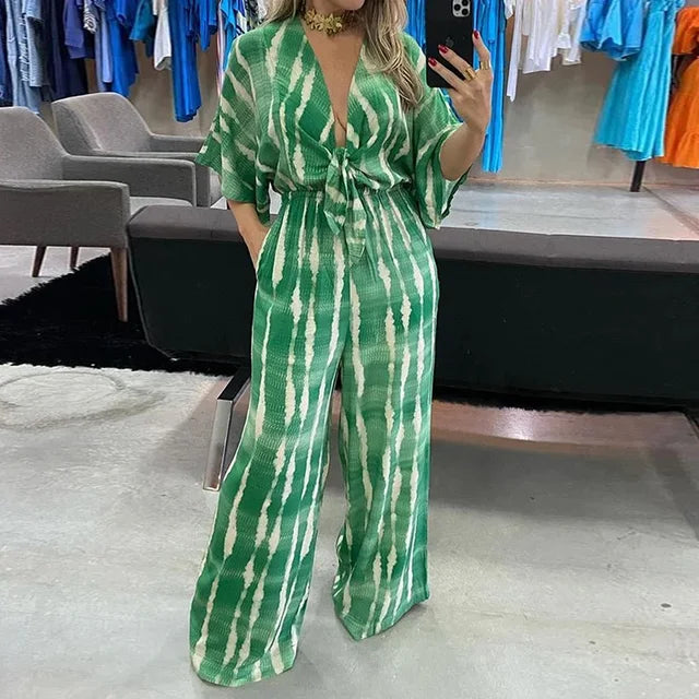Dame jumpsuit med dyb V-hals, vide ben og blonde detaljer, sommerkjole