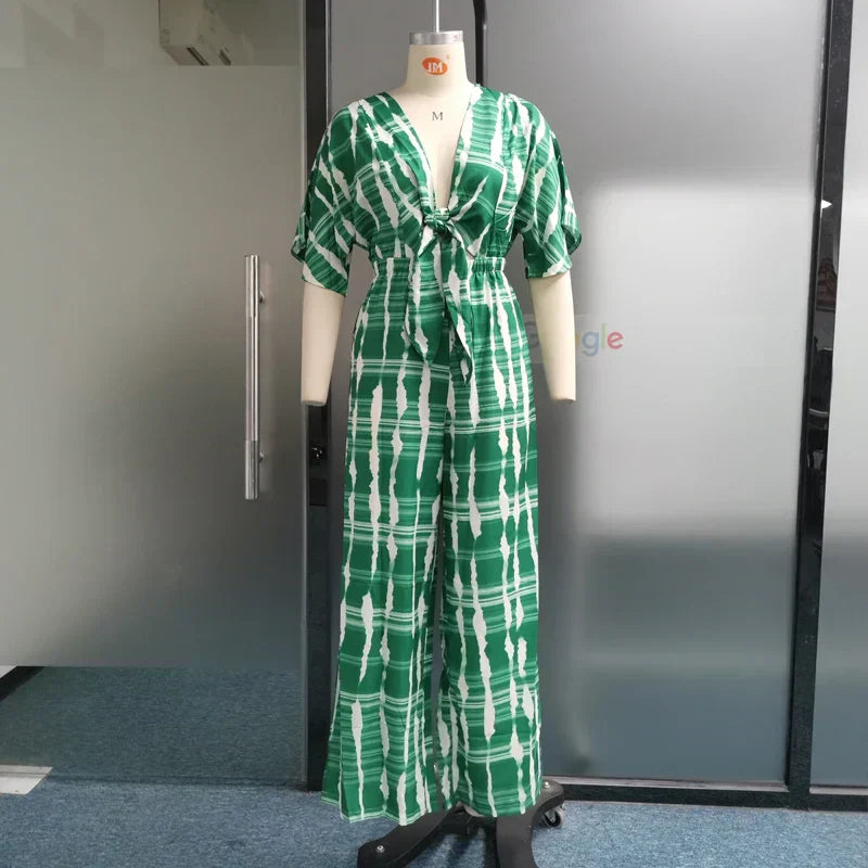 Dame jumpsuit med dyb V-hals, vide ben og blonde detaljer, sommerkjole