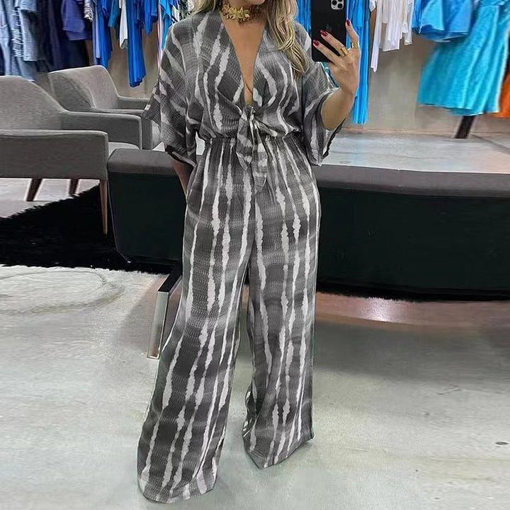 Dame jumpsuit med dyb V-hals, vide ben og blonde detaljer, sommerkjole