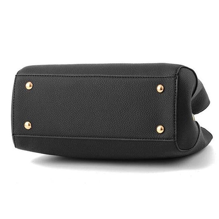 Dame skuldertaske med blomsterhåndtag, struktureret tote-stil, skinnende finish, justerbar rem.