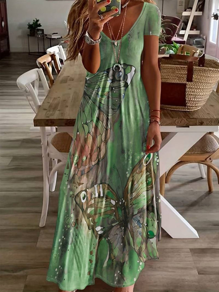 Dame sommerkjole med V-udskæring, sommerfuglprint, let og elegant til sommerfester, blød og nem at pleje.