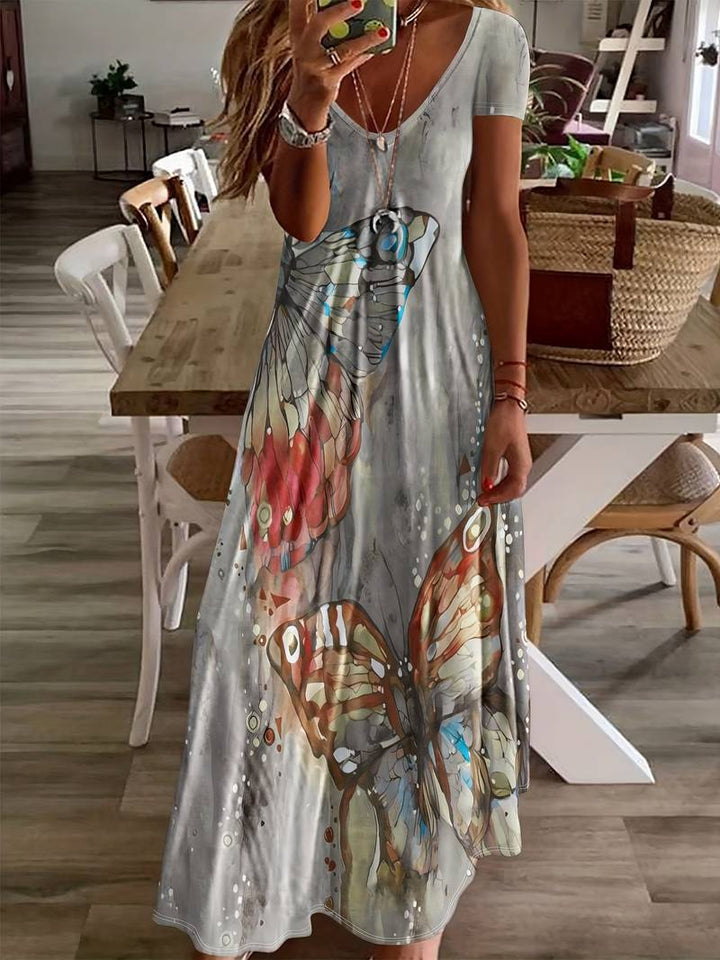 Dame sommerkjole med V-udskæring, sommerfuglprint, let og elegant til sommerfester, blød og nem at pleje.