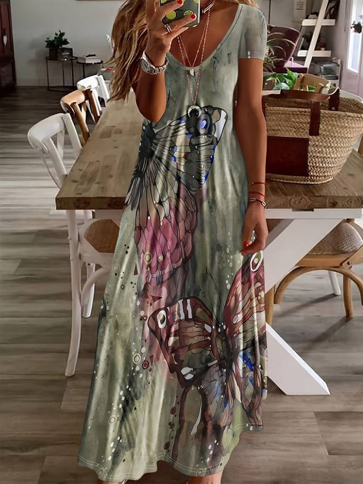 Dame sommerkjole med V-udskæring, sommerfuglprint, let og elegant til sommerfester, blød og nem at pleje.