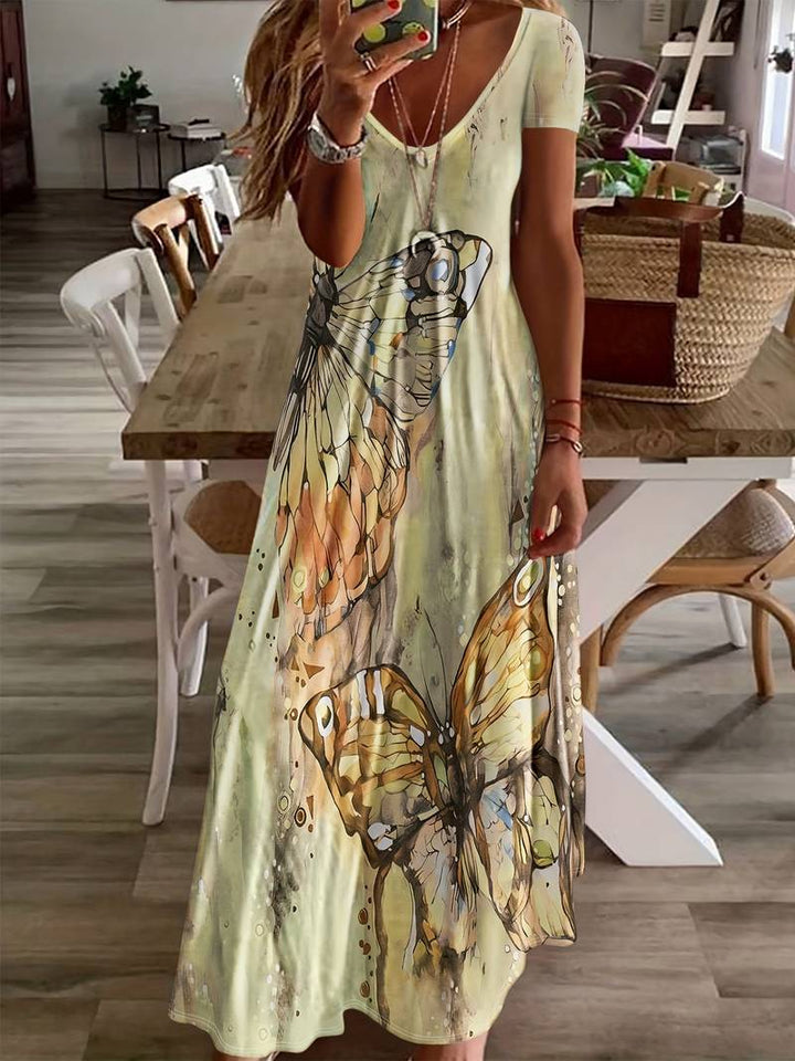 Dame sommerkjole med V-udskæring, sommerfuglprint, let og elegant til sommerfester, blød og nem at pleje.