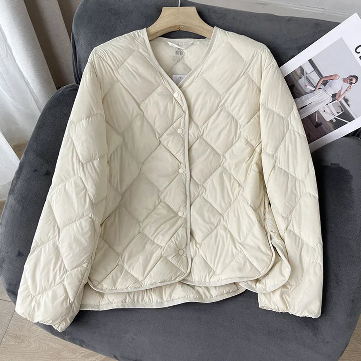 "Naisten kevyt kaulukseton puffer-takki, beige, syksyyn ja talveen, mukava ja moderni muotoilu, lämpöä arkeen."