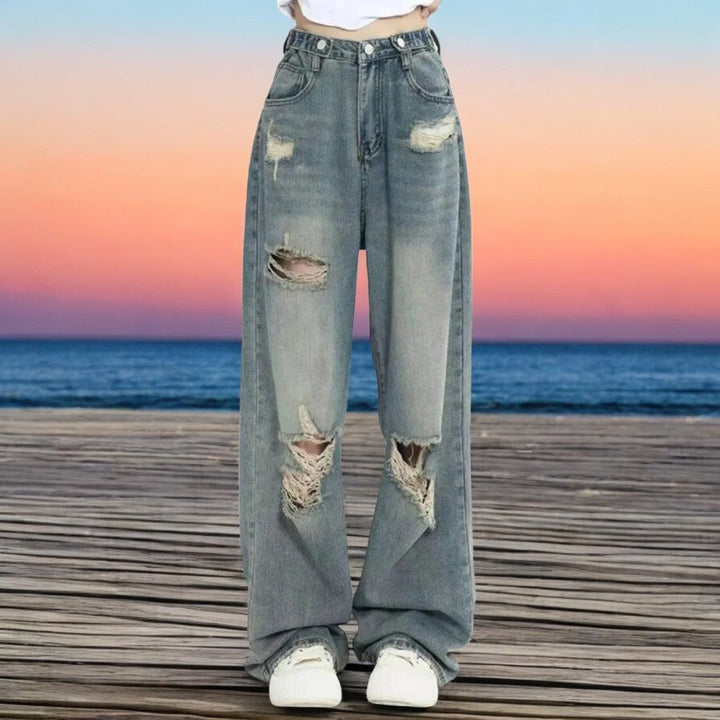 Dame jeans med høj talje og brede ben, vintage stil, blå, flatterende snit, trendy mode.