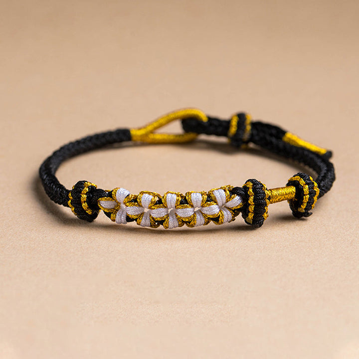 Dame håndvævet persikablomst armbånd, justerbart, flerfarvet knudemønster, højkvalitets materialer, etnisk stil