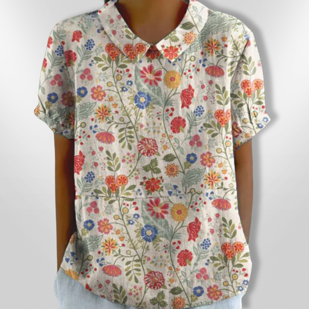 Damebluse med blomsterprint, afslappet stil, blomstermønster, klassisk krave, korte ærmer, let stof, egnet til hverdag og fest.