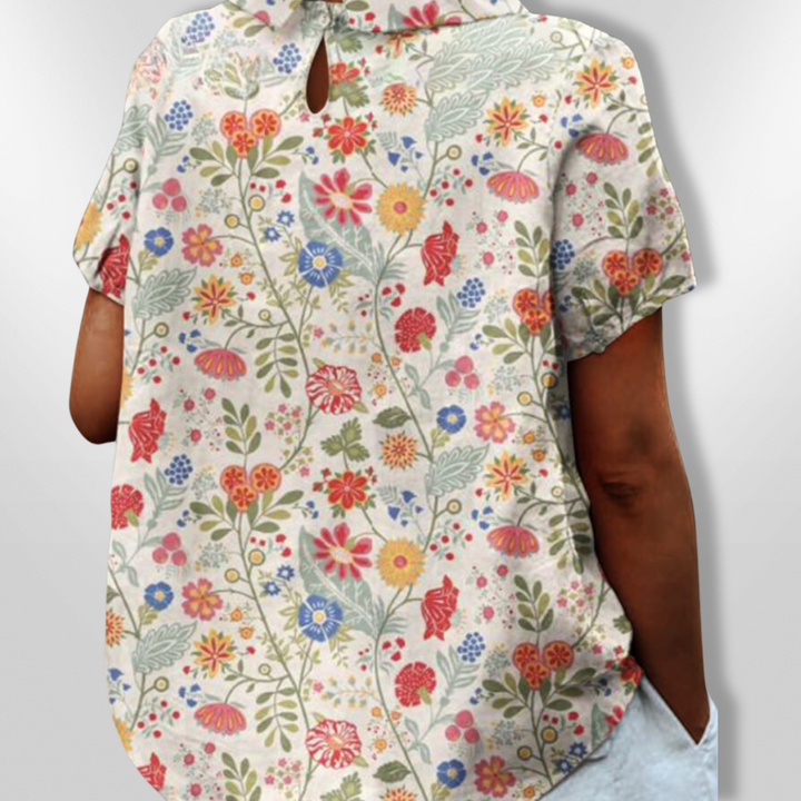 Damebluse med blomsterprint, afslappet stil, blomstermønster, klassisk krave, korte ærmer, let stof, egnet til hverdag og fest.