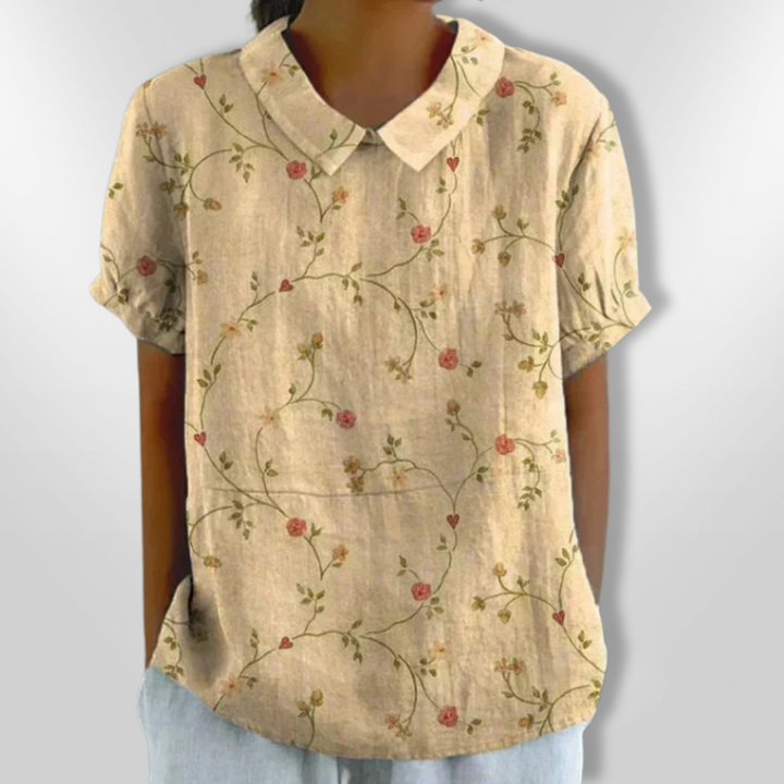 Damebluse med blomsterprint, afslappet stil, blomstermønster, klassisk krave, korte ærmer, let stof, egnet til hverdag og fest.