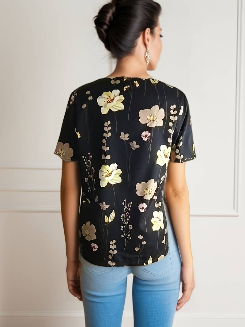 Dameblomstret bluse til foråret, løs pasform, delikat blomstermønster, blød og behagelig.