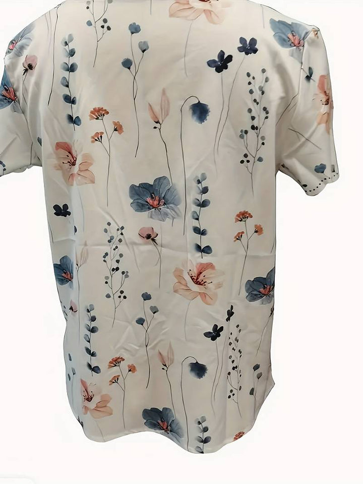Dameblomstret bluse til foråret, løs pasform, delikat blomstermønster, blød og behagelig.