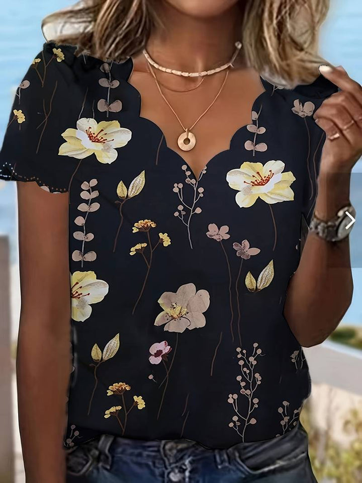 Dameblomstret bluse til foråret, løs pasform, delikat blomstermønster, blød og behagelig.