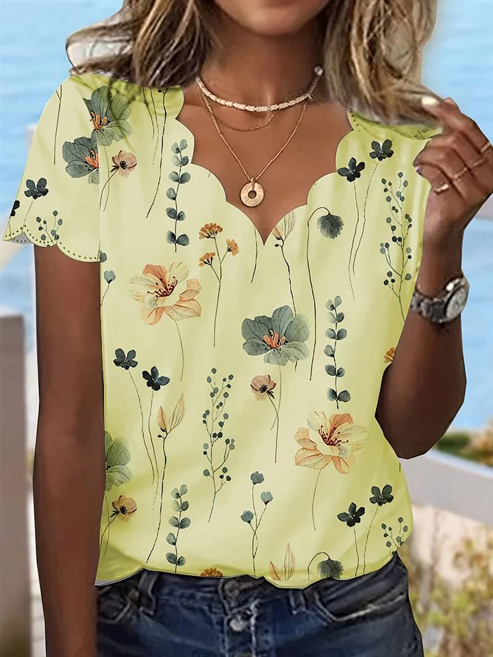 Dameblomstret bluse til foråret, løs pasform, delikat blomstermønster, blød og behagelig.