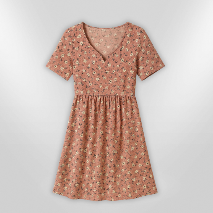 Dame sommerkjole med blomstermønster og åben silhuet. Let, feminin stil perfekt til sommer.