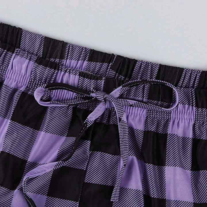Dame vidt benede ternede pyjamasbukser, klassisk ternet mønster, blødt materiale, komfort og stil til vinteraftener.