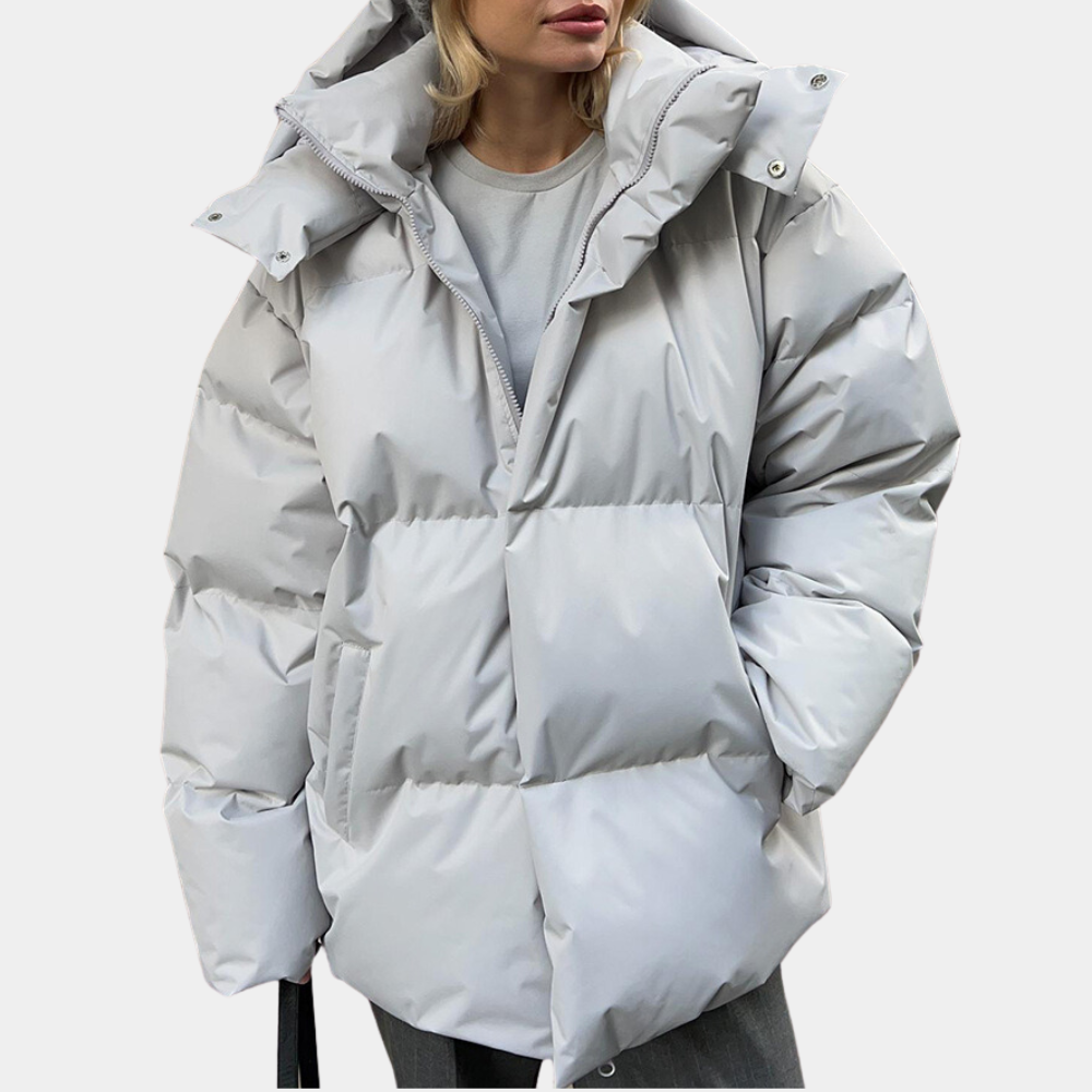 Naisten lämmin vinterjakke, moderni tuulitakki, etupuoli näytetty, musta vedenpitävä kangas ja säädettävä huppu.