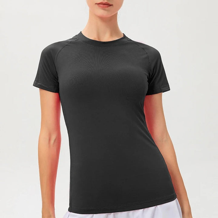 Dame kompressions-t-shirt med korte ærmer, elastisk og hurtigtørrende, perfekt til træning og sport.