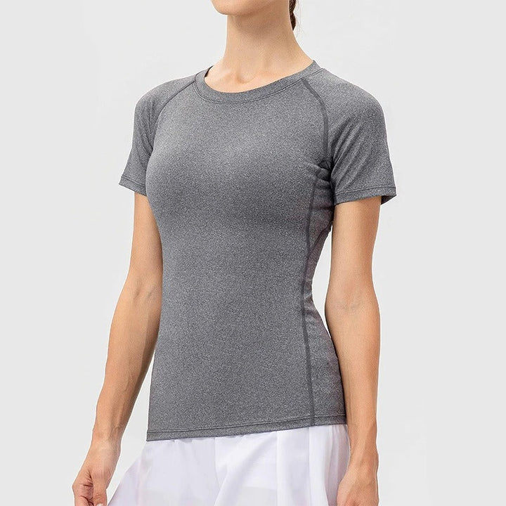 Dame kompressions-t-shirt med korte ærmer, elastisk og hurtigtørrende, perfekt til træning og sport.