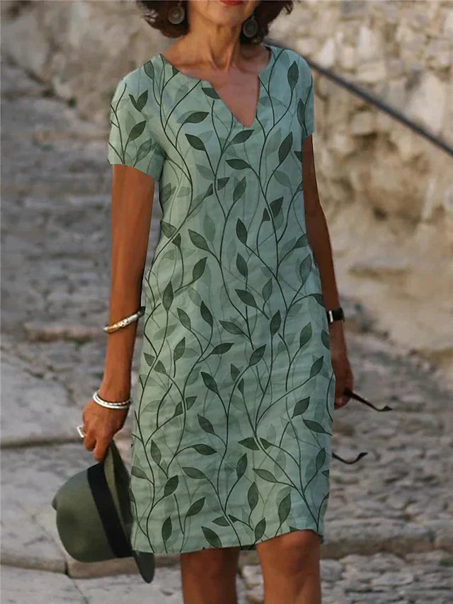 Dame midikjole, grøn-blå, V-udskæring, korte ærmer, elegant og behagelig sommerkjole.