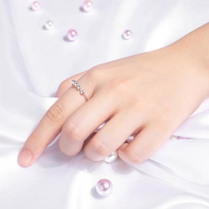 Dame beroligende ring, rosaguld, med roterende metalperler, elegant og beroligende, håndlavet smykketilbehør.