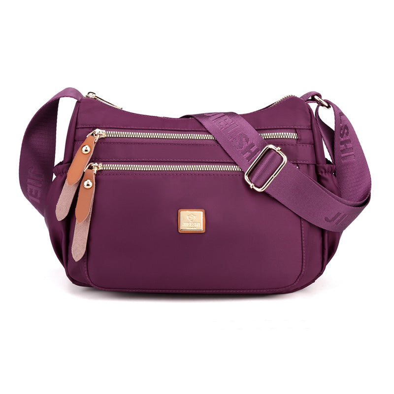 Dame multi-lags nylon skuldertaske, grå, elegant og rummelig, flere lommer, perfekt til hverdagsbrug.