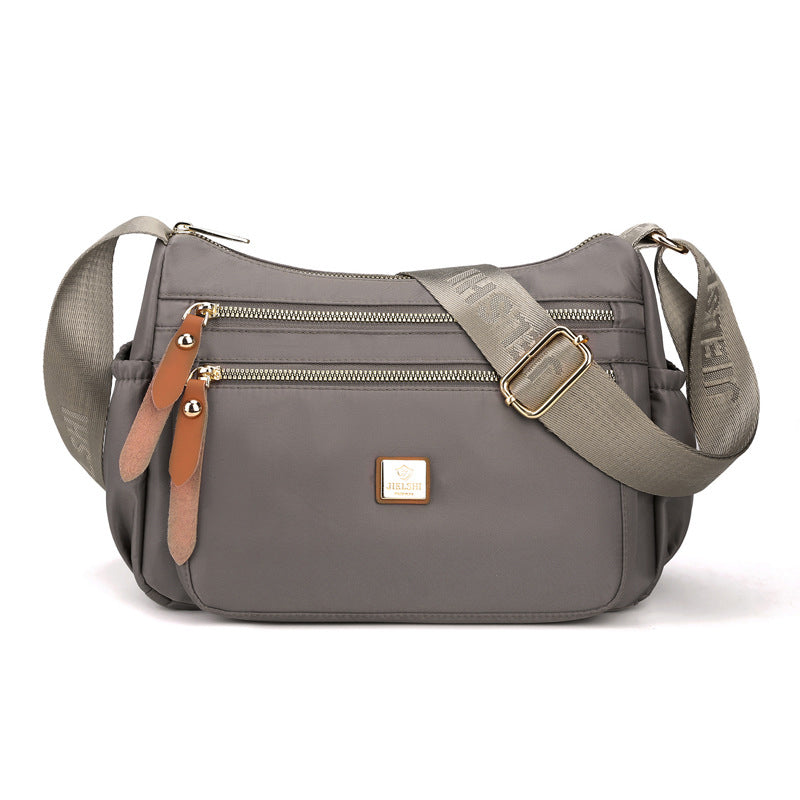 Dame multi-lags nylon skuldertaske, grå, elegant og rummelig, flere lommer, perfekt til hverdagsbrug.