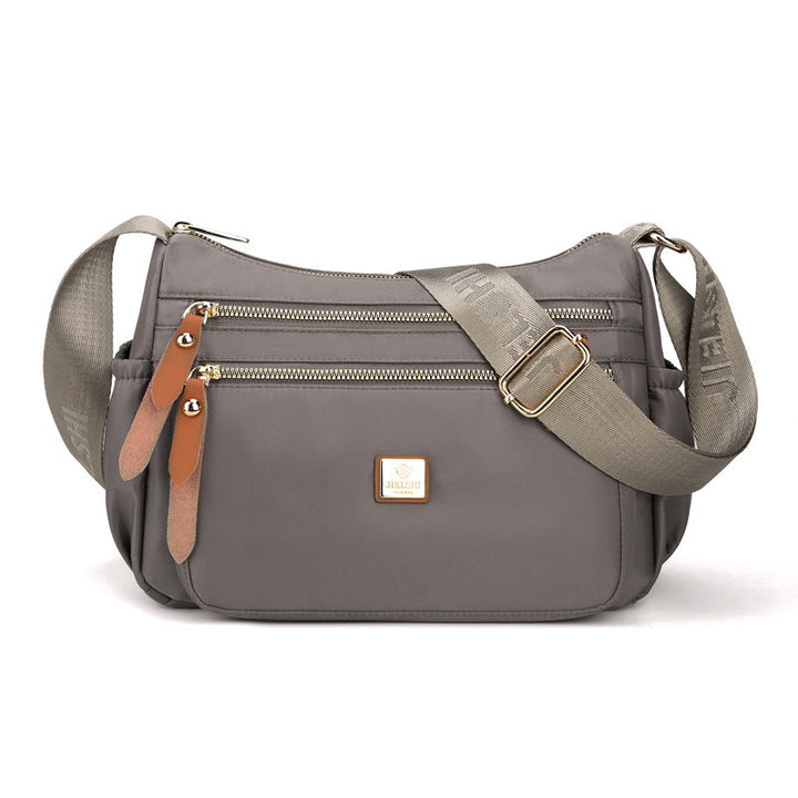 Dame multi-lags nylon skuldertaske, grå, elegant og rummelig, flere lommer, perfekt til hverdagsbrug.