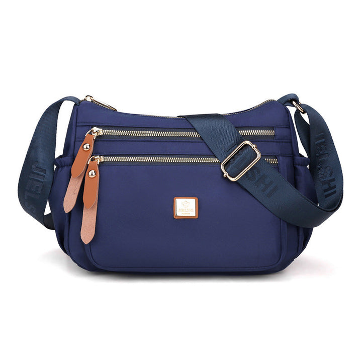Dame multi-lags nylon skuldertaske, grå, elegant og rummelig, flere lommer, perfekt til hverdagsbrug.