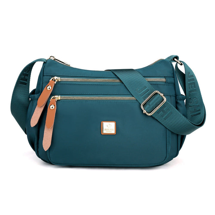 Dame multi-lags nylon skuldertaske, grå, elegant og rummelig, flere lommer, perfekt til hverdagsbrug.
