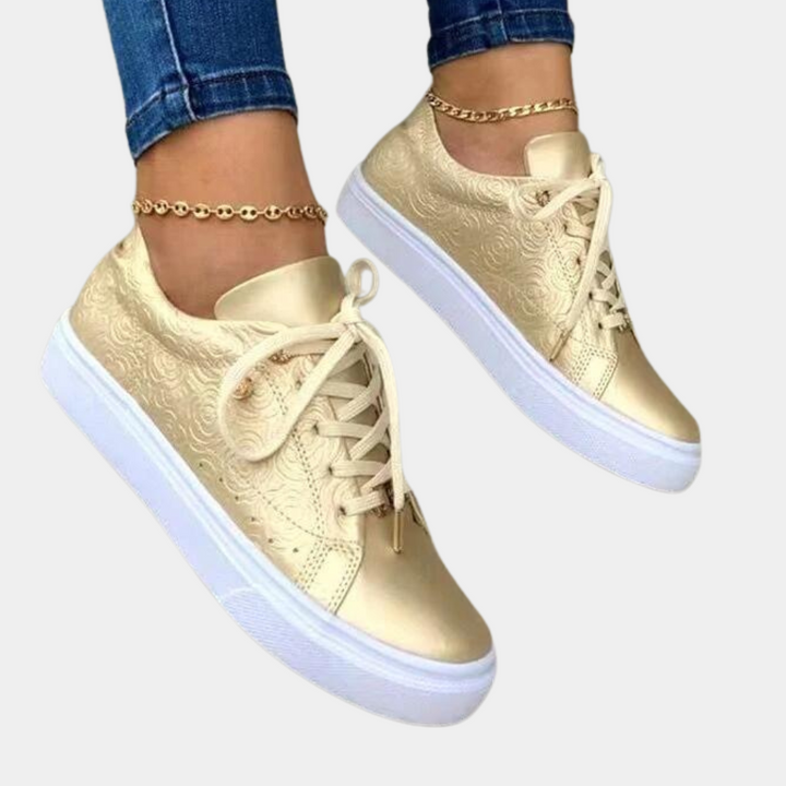 Naisten muodikkaat sneakerit keinonahalla, moderni design, kiiltävä pinta, pehmustettu sisäpuoli, monipuoliset värit.