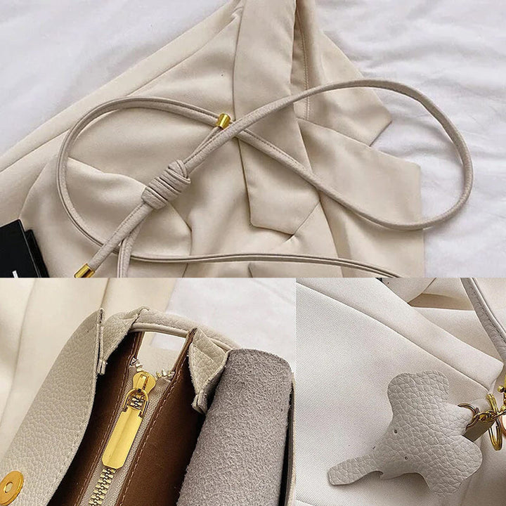 Naisten muoti crossbody laukku, musta PU-nahka, norsuriipus koriste, tyylikäs ja käytännöllinen päivän asuste.