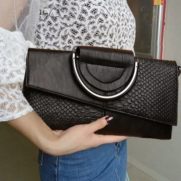 Dame crossbody håndtaske, minimalistisk design, pudderblød tone, krydset skulderrem