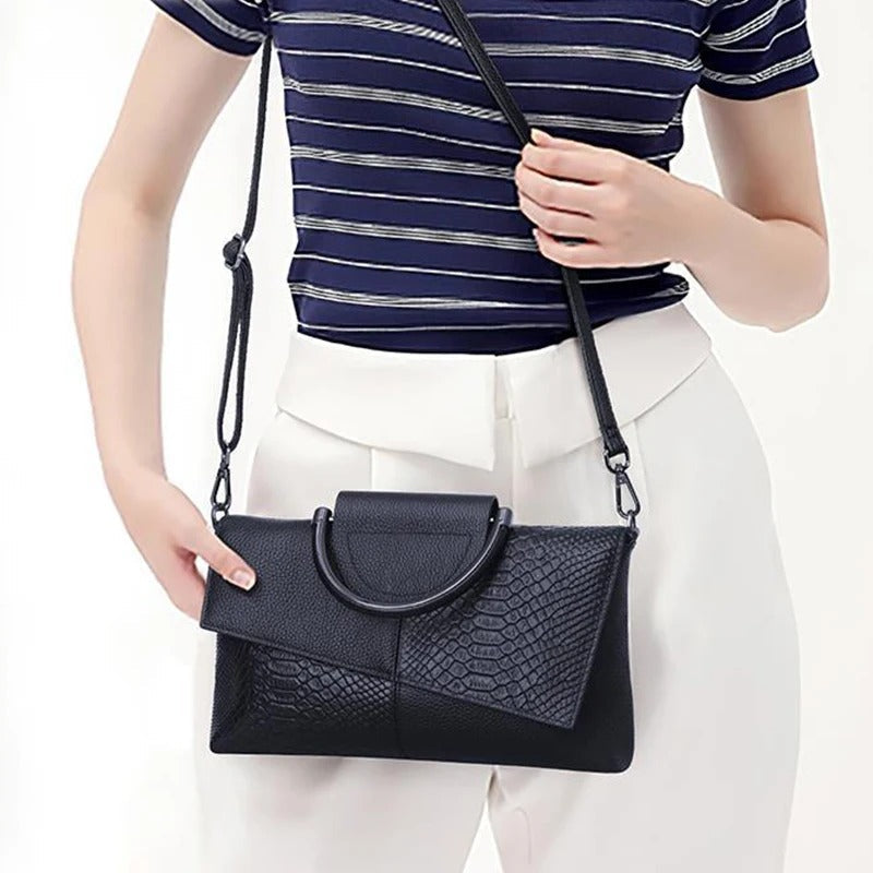 Dame crossbody håndtaske, minimalistisk design, pudderblød tone, krydset skulderrem