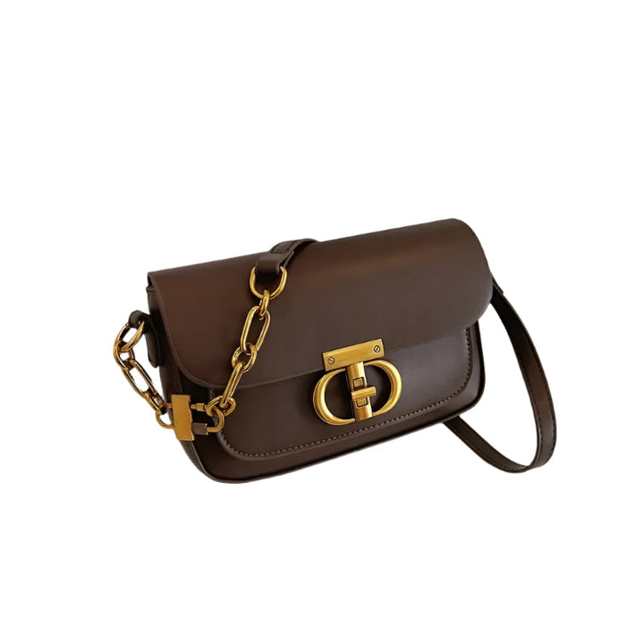 Dame crossbody taske, sort og brun, minimalistisk design, justerbar rem, kompakt størrelse.