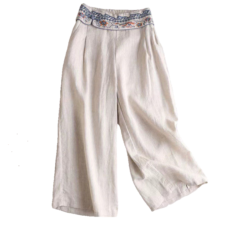 Dame linnedbukser forfra, broderet talje, lys farve, afslappet og stilfuldt sommeroutfit til elegante lejligheder.