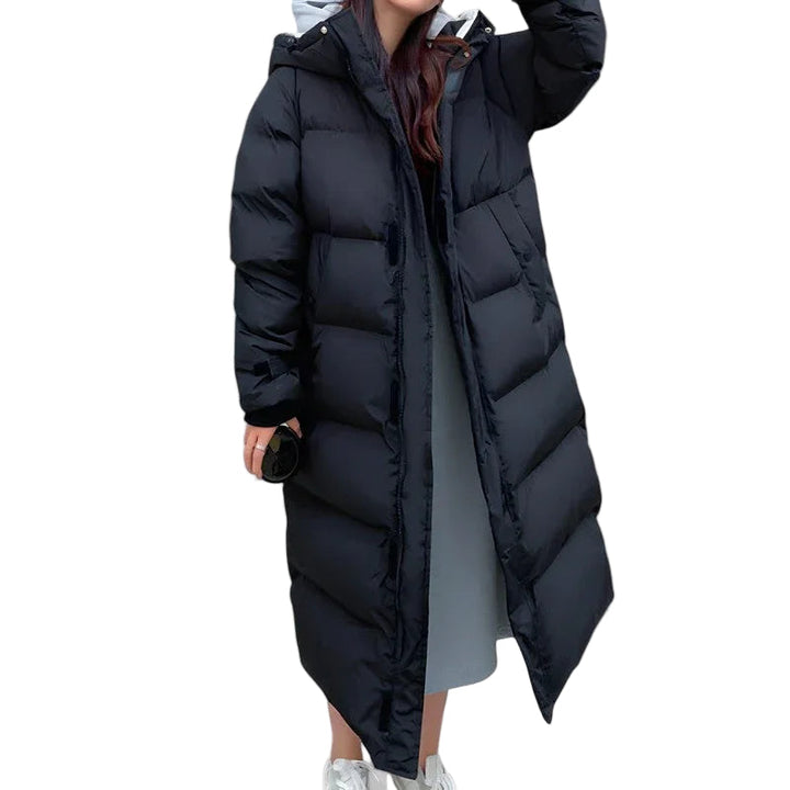 Dame lang vandtæt pufferparka jakke i sort, med justerbar hætte, der tilbyder varme og stil til vintervejr.