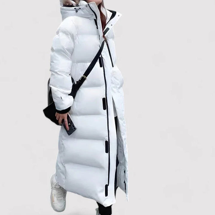Dame lang vandtæt pufferparka jakke i sort, med justerbar hætte, der tilbyder varme og stil til vintervejr.