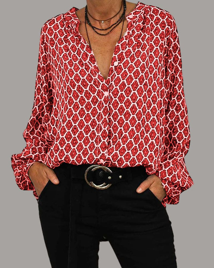 Dame langærmet bluse med geometrisk mønster, elegant V-udskæring, moderne og behagelig at have på.