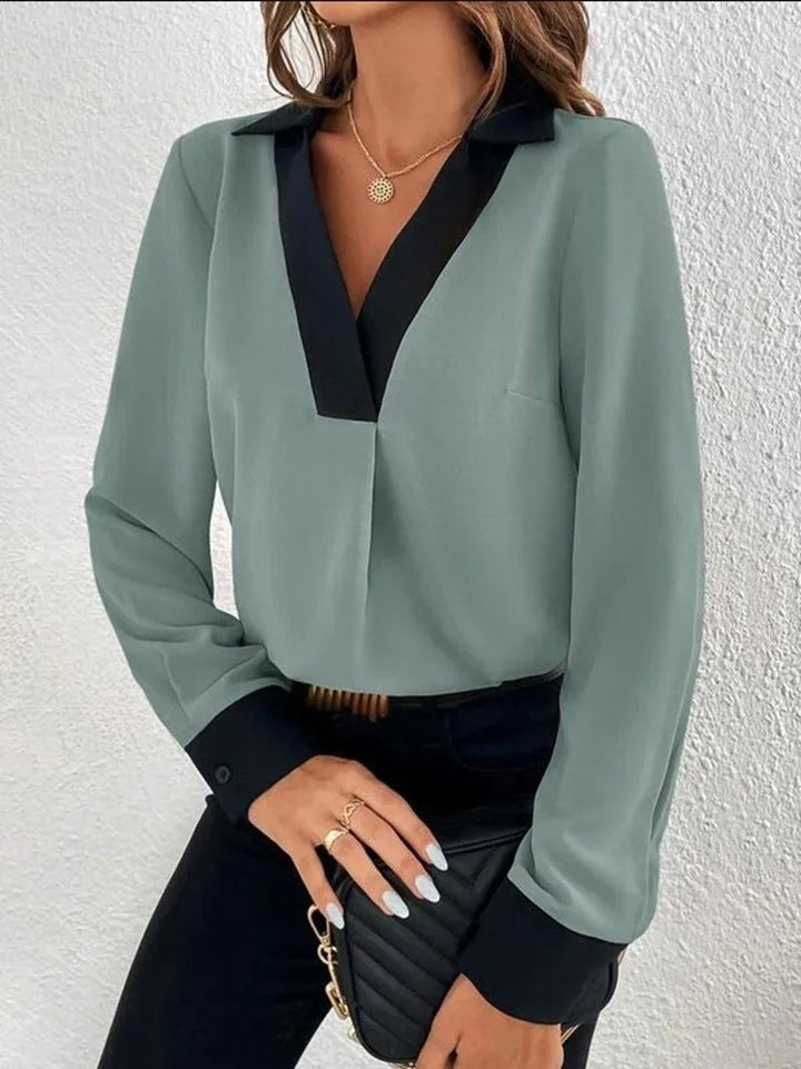 Dame langærmet kontorbluse med et elegant udseende og behagelig pasform.