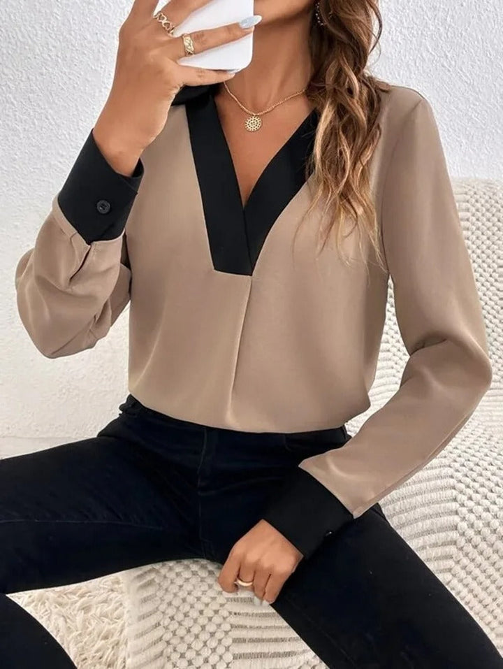 Dame langærmet kontorbluse med et elegant udseende og behagelig pasform.