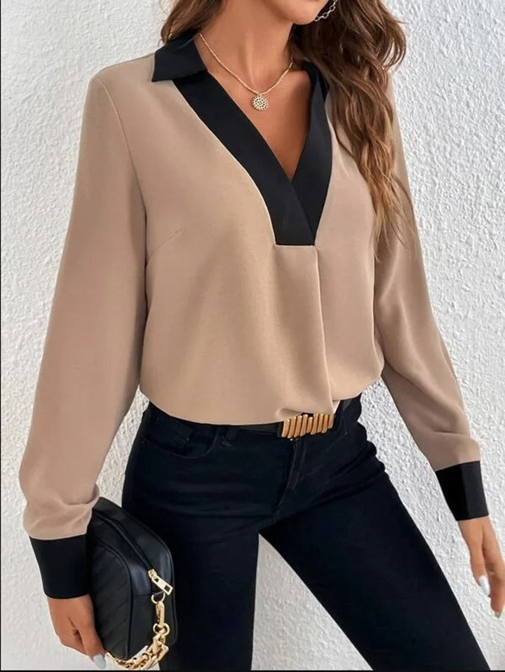 Dame langærmet kontorbluse med et elegant udseende og behagelig pasform.