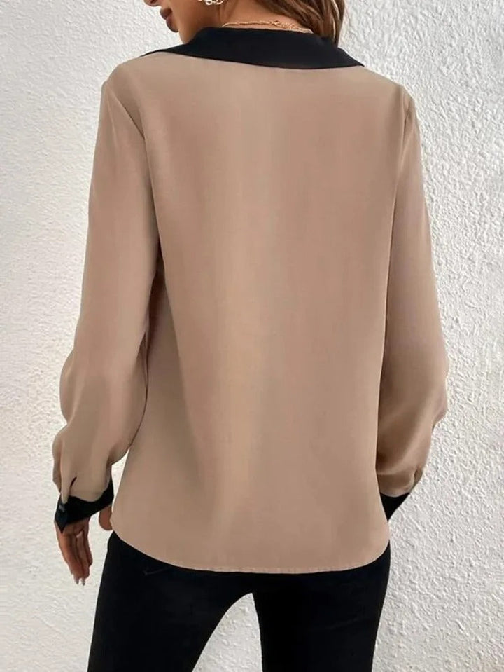 Dame langærmet kontorbluse med et elegant udseende og behagelig pasform.