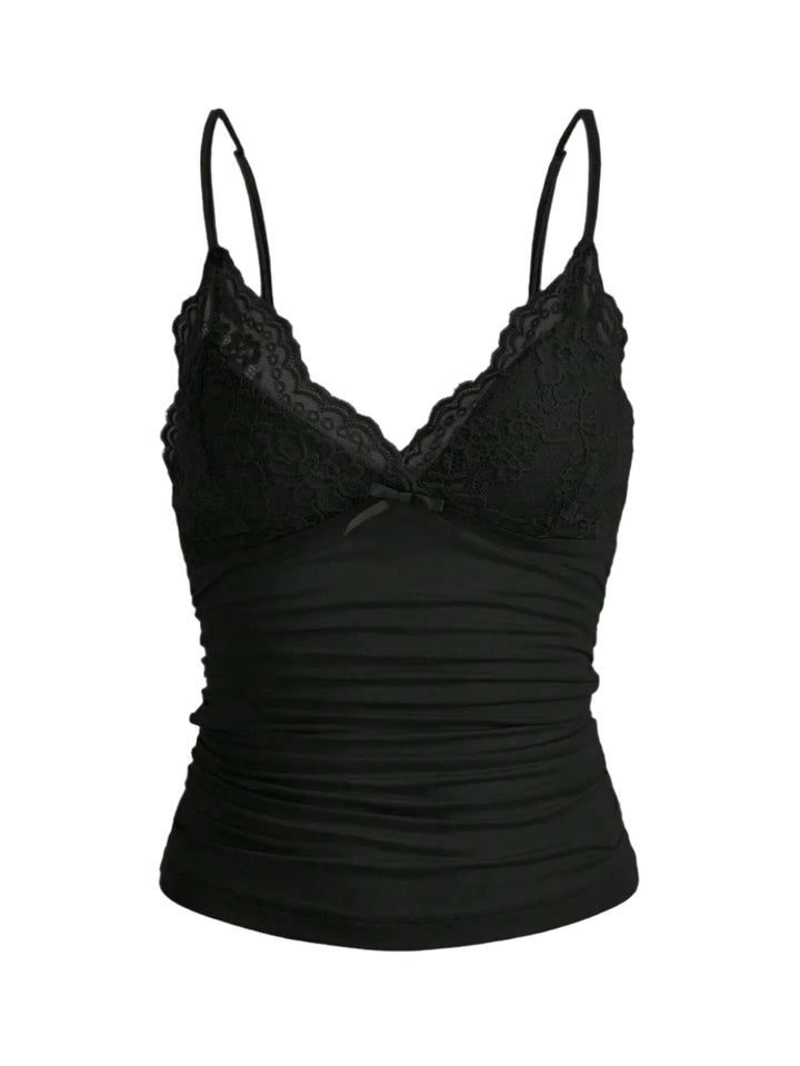 Dame kort top med blondekant og sløjfe. Let, justerbare stropper, perfekt til sommerlook.